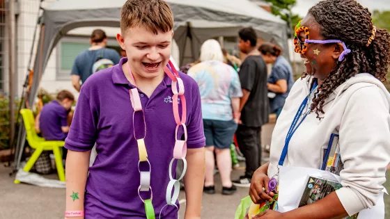 social worker at st piers laughing with a student